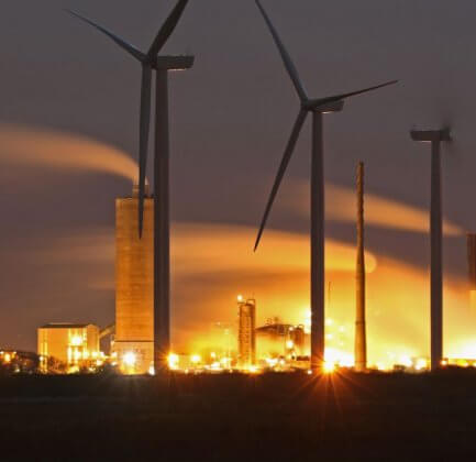 Wind Turbines are seen on Ince Salt Marshes near to chemical and manufacturing plants on the River Mersey estuary on November 7, 2016 in Runcorn, England.