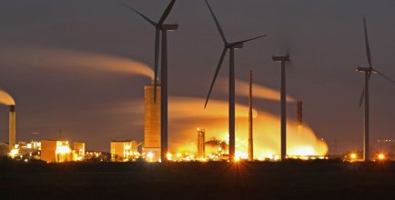 Wind Turbines are seen on Ince Salt Marshes near to chemical and manufacturing plants on the River Mersey estuary on November 7, 2016 in Runcorn, England.