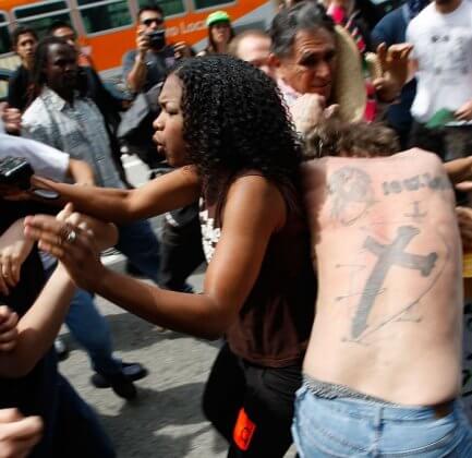 Arguments breaking out between white and black Americans during a National Socialist Movement rally in LA in 2010.
