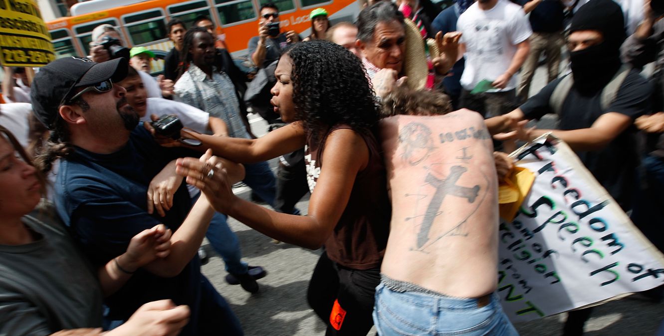 Arguments breaking out between white and black Americans during a National Socialist Movement rally in LA in 2010.