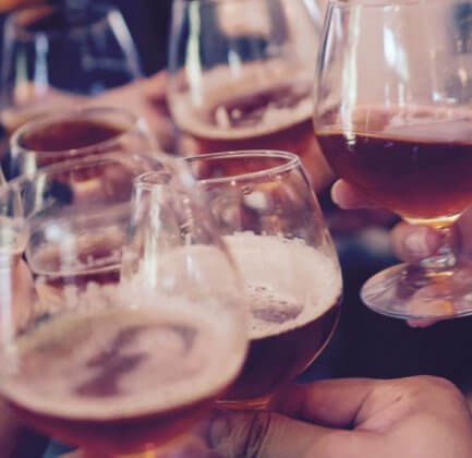 family raising a glass (we see just hands)