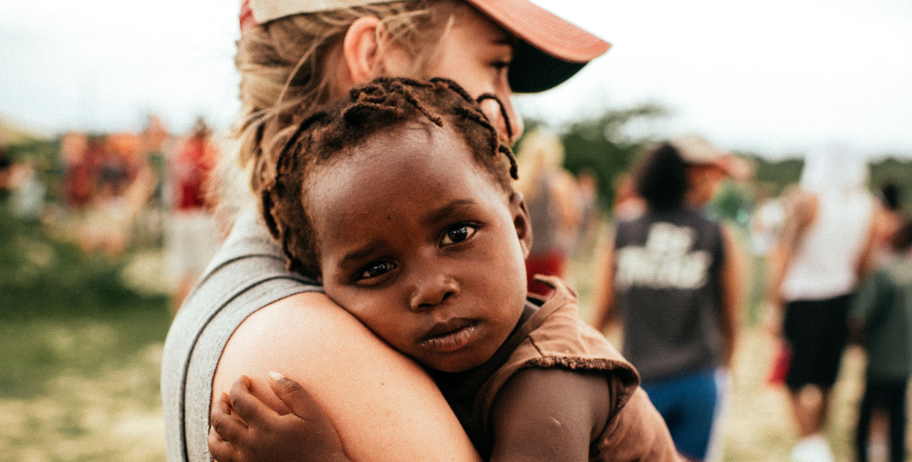 volunteer holding a baby