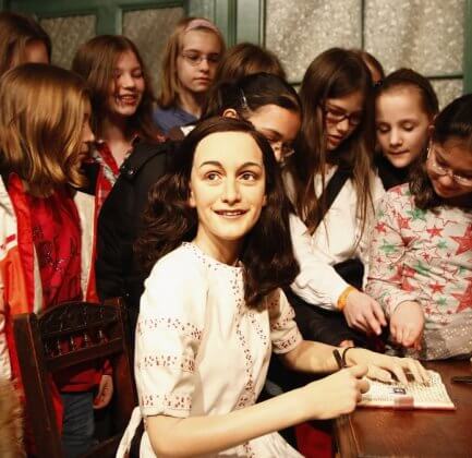 Schoolchildren at an Anne Frank exhibit.
