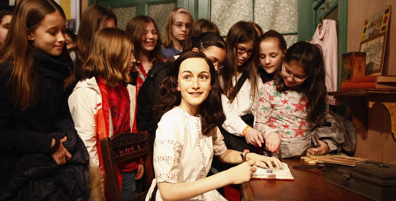 Schoolchildren at an Anne Frank exhibit.